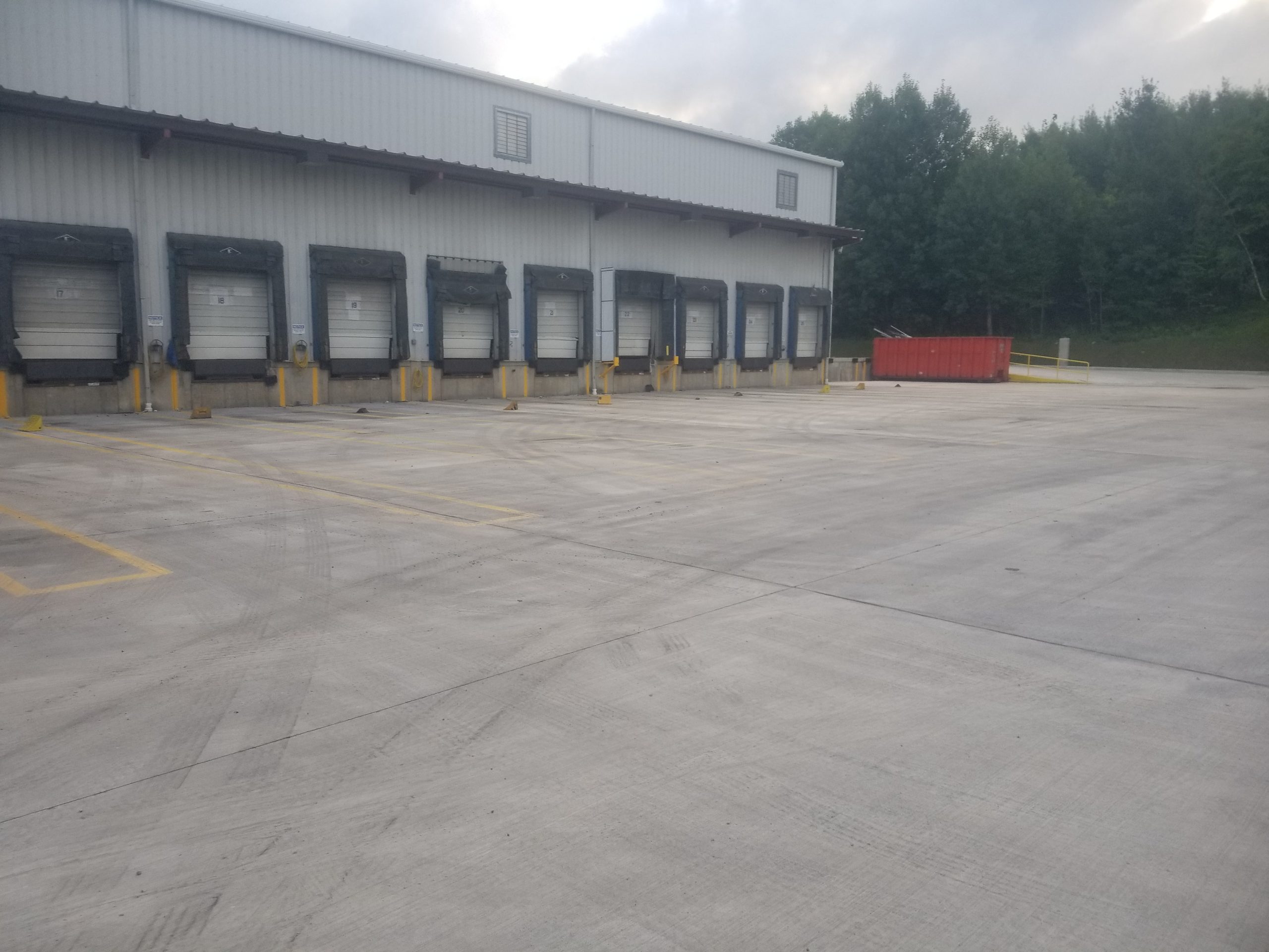 Concrete forming and preparation for a commercial floor slab